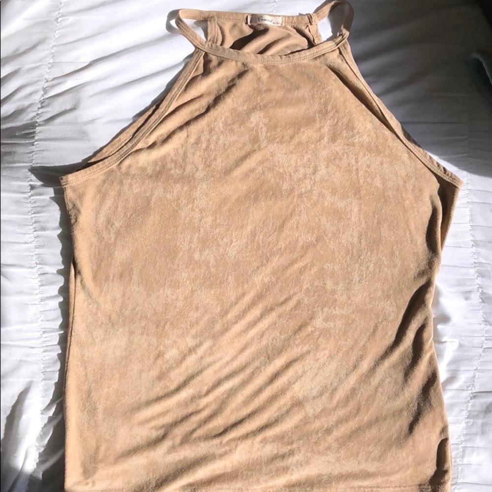 A beige velvet tank top